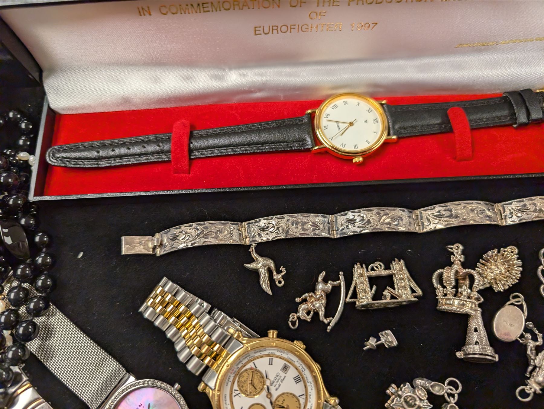 Silver jewellery, including charms, three bracelets and pendant, together with a Seiko wristwatch, Skagen wristwatch, costume jewellery and  a lighter