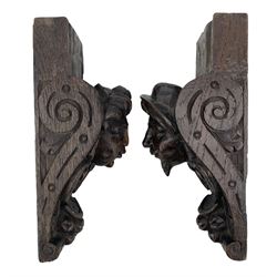 Pair of Victorian figural carved oak corbels, modelled as male and female masks, with scroll and fruit details, H22cm x W8.5cm 