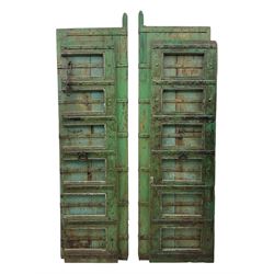 Pair of green-painted Indian doors, c.1860–1880, made from solid teak featuring original i...