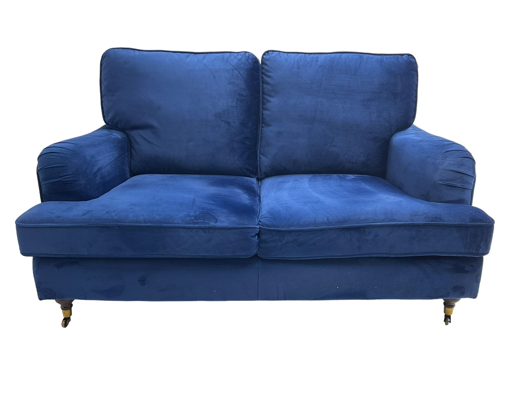 Howard design - two-seat sofa upholstered in blue fabric, traditional shape with rolled arms, on walnut finish turned feet with brushed metal cups and castors