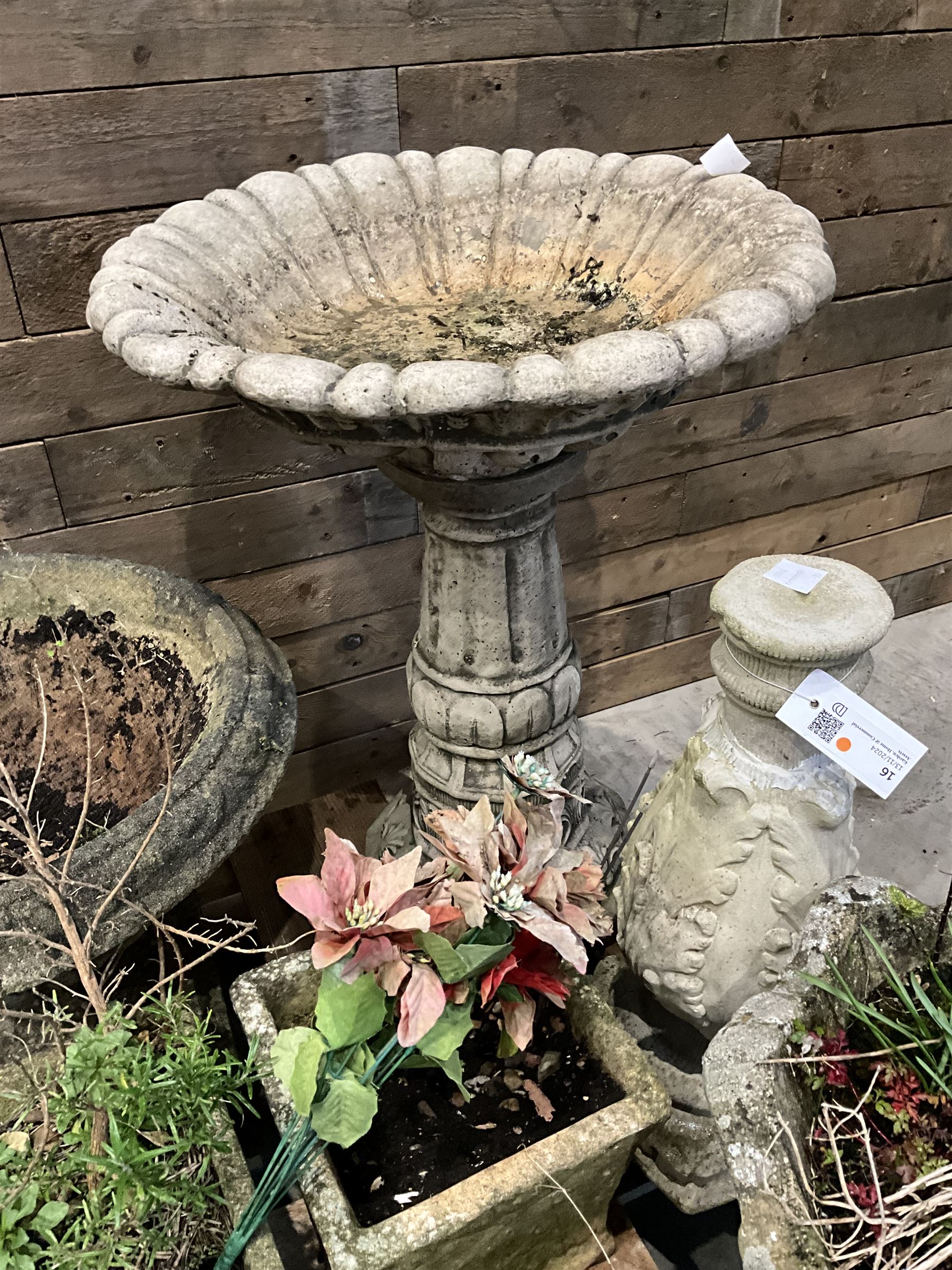 Cast stone circular urn, large bird bath, other urn, two square planters, two rectangular planters and bird bath (9)