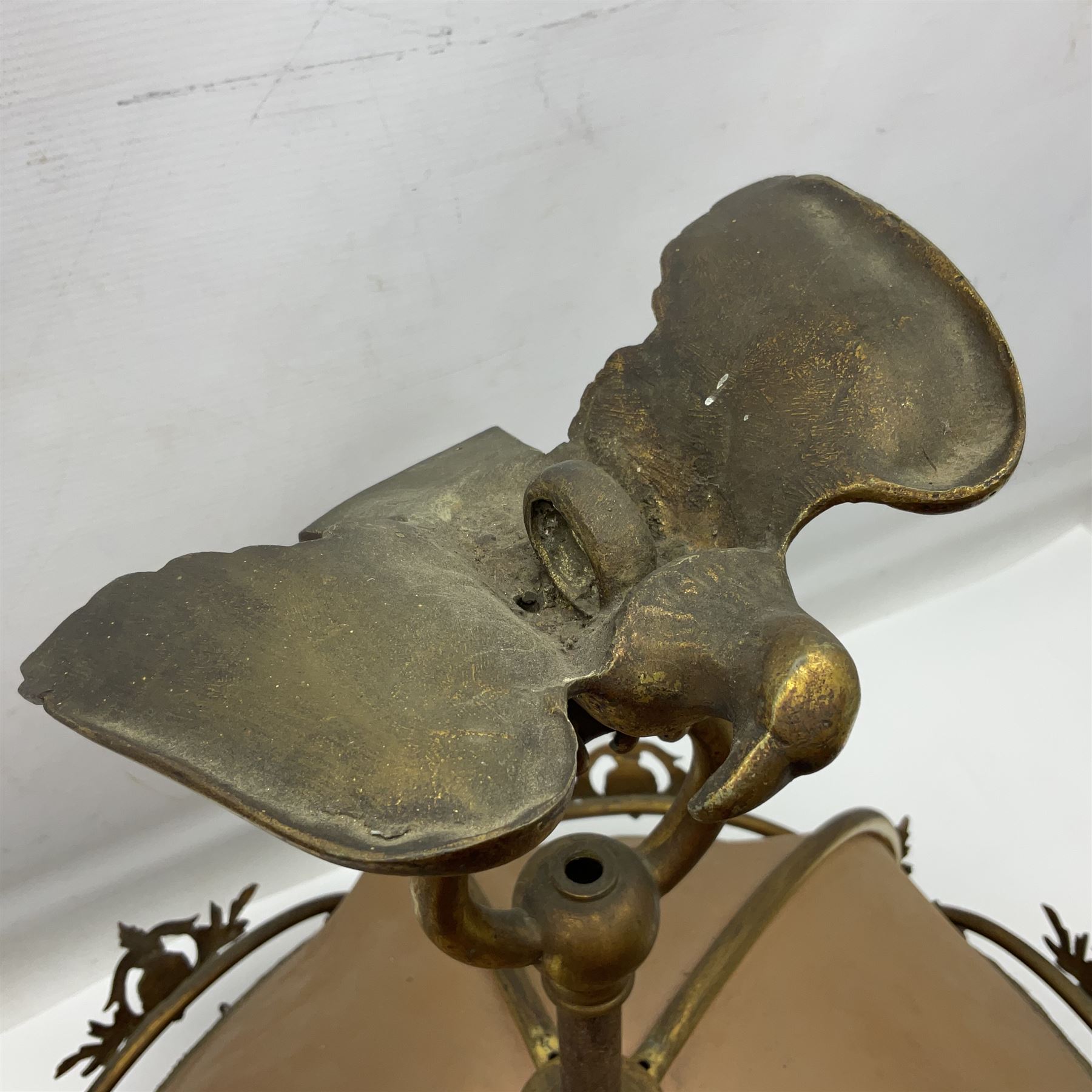 Brass framed ceiling light with eagle finial, H55cm