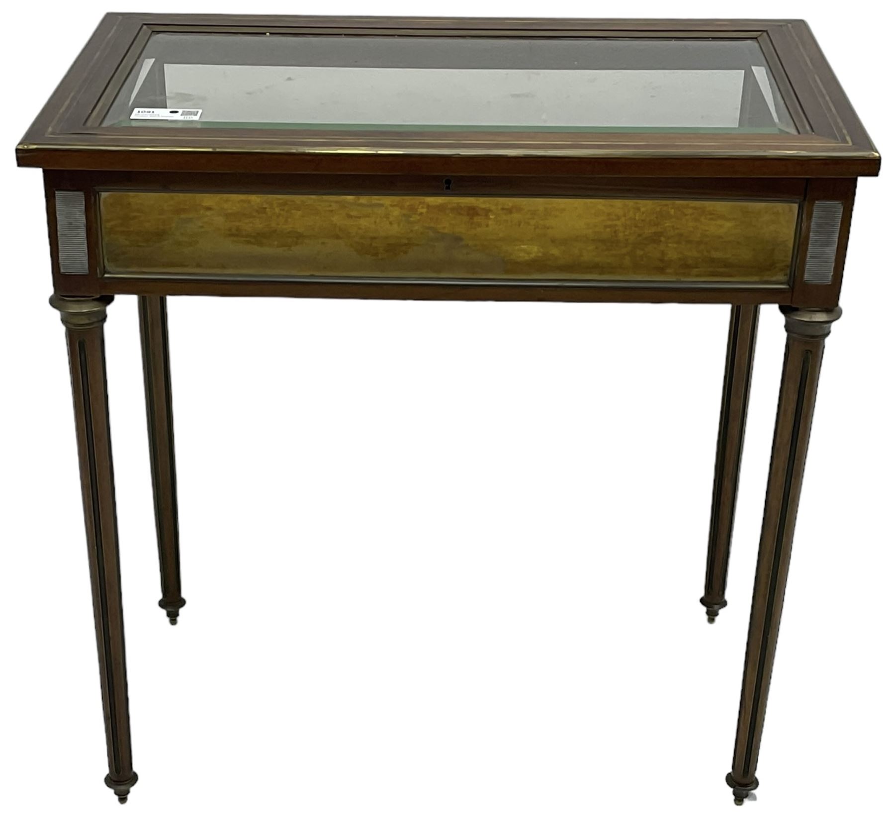 Walnut and brass inlaid bijouterie cabinet, the rectangular lid with bevelled glass pane inlaid with brass stringing, velvet lined interior, on tapering turned and fluted supports with brass collars and feet