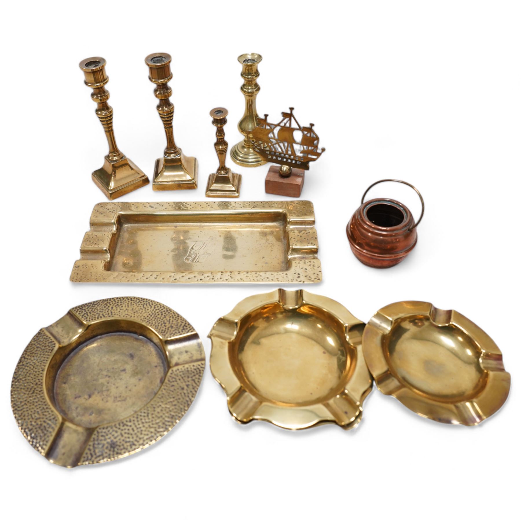 Cast brass Punch doorstop, brass coal scuttle, various fire irons,miniature candlesticks, ashtrays etc 