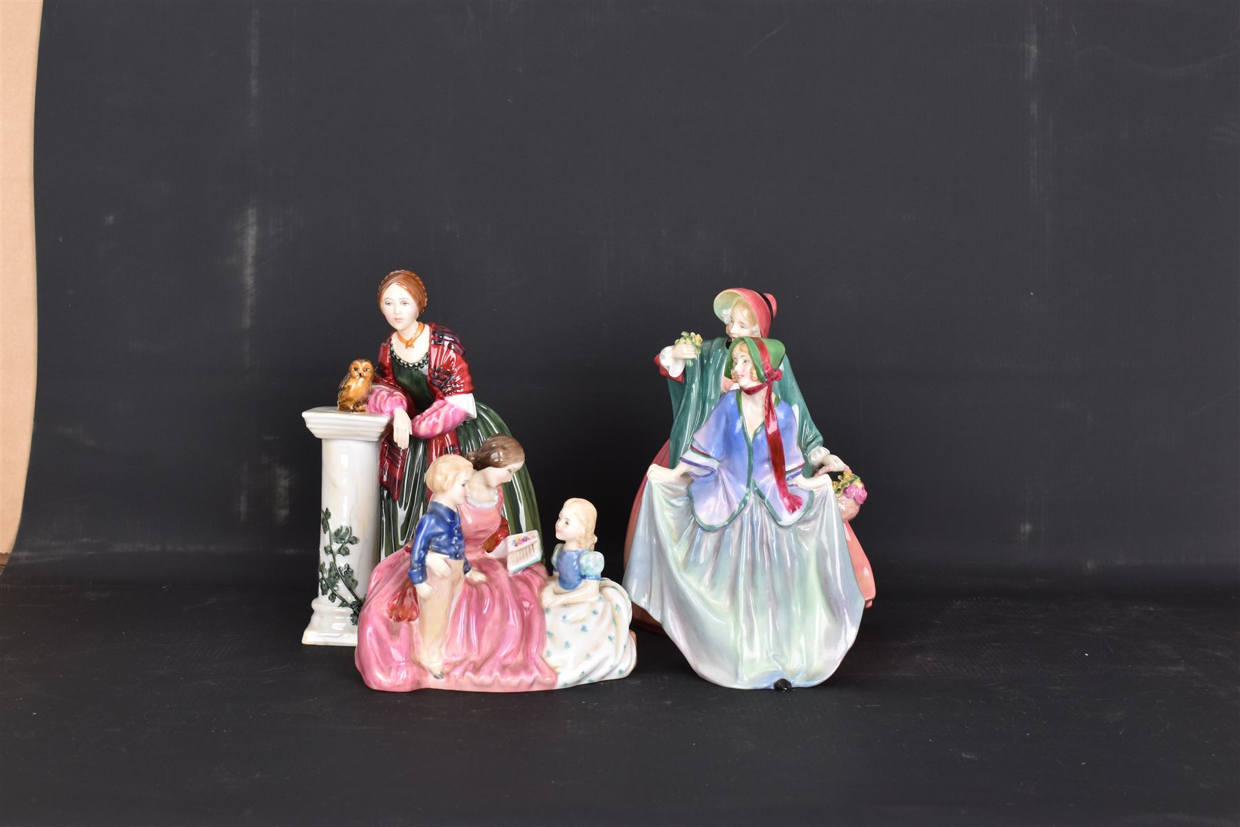 Four Royal Doulton figures, comprising Florence Nightingale HN3144, The Bedtime Story HN2059, Lady Charmain HN1949 and Sweet Anne HN1315 