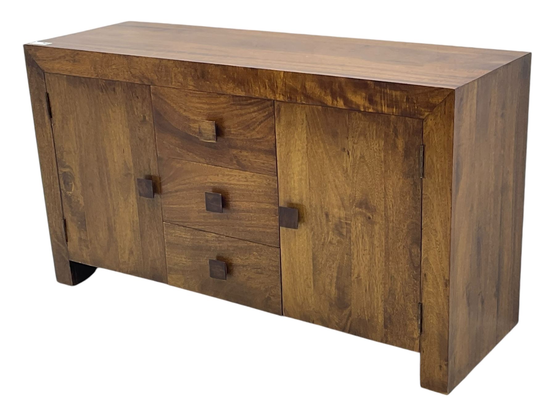 Contemporary Dakota mango wood sideboard, plain rectangular top over three central drawers flanked by cupboards with shelving, each with square pulls, raised on stile supports