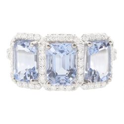 18ct white gold three stone emerald cut aquamarine and round brilliant cut diamond cluster...