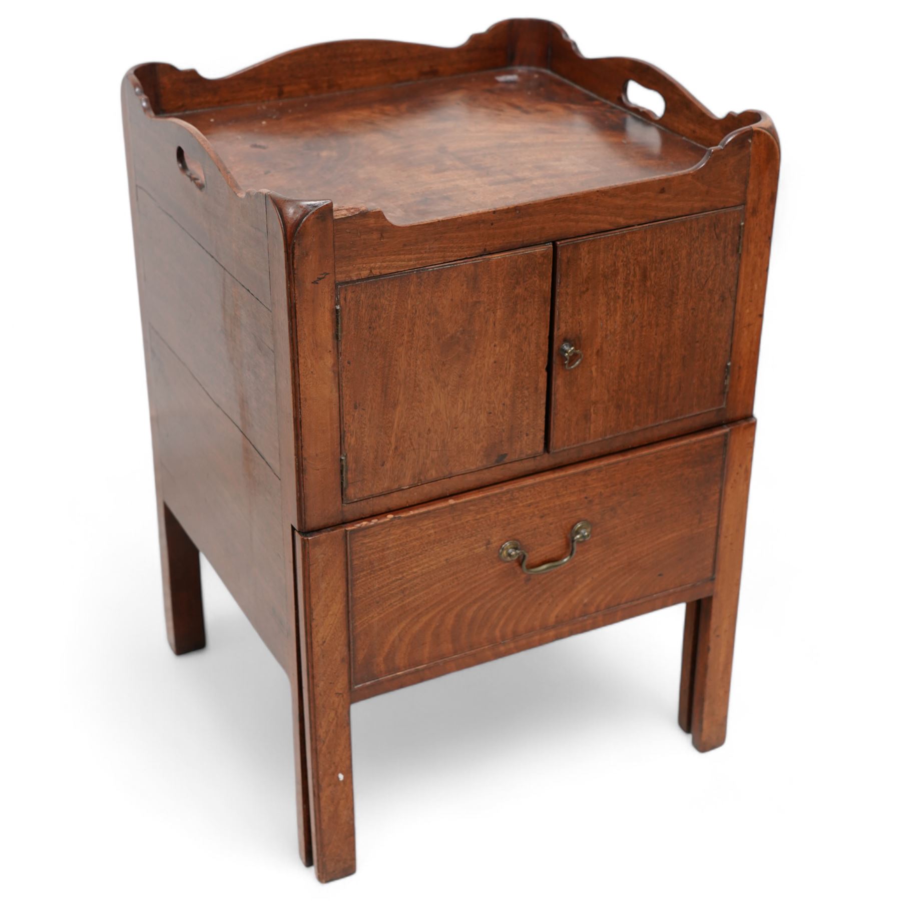 George III mahogany night commode, tray-top with pierced handles, fitted with cupboard over commode drawer, on square moulded supports