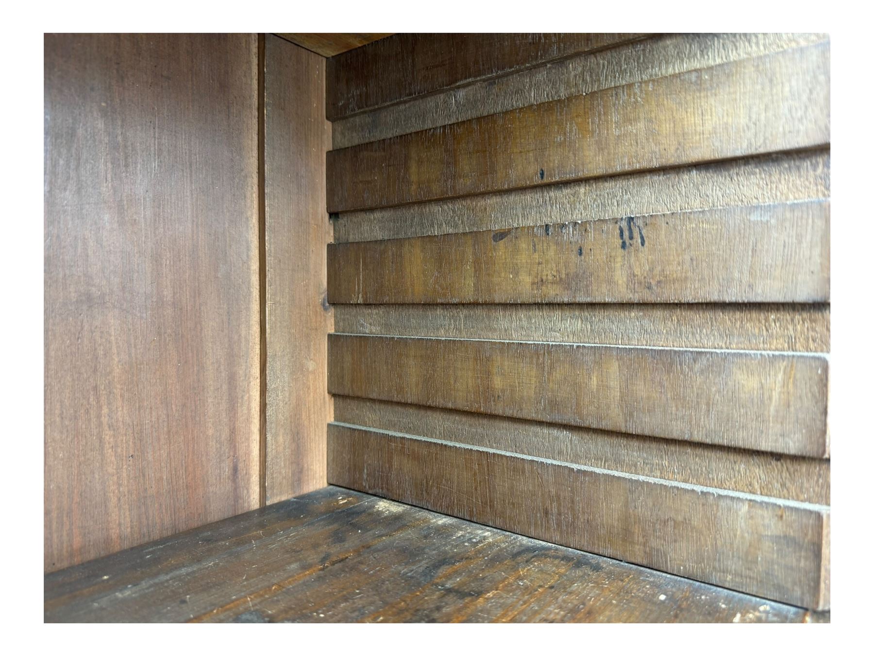 Early 19th century mahogany bureau bookcase, the projecting cornice over two Gothic-style astragal glazed doors enclosing two adjustable shelves, sloped hinged lid enclosing fitted interior and felt inset, four graduating drawers, on bracket feet