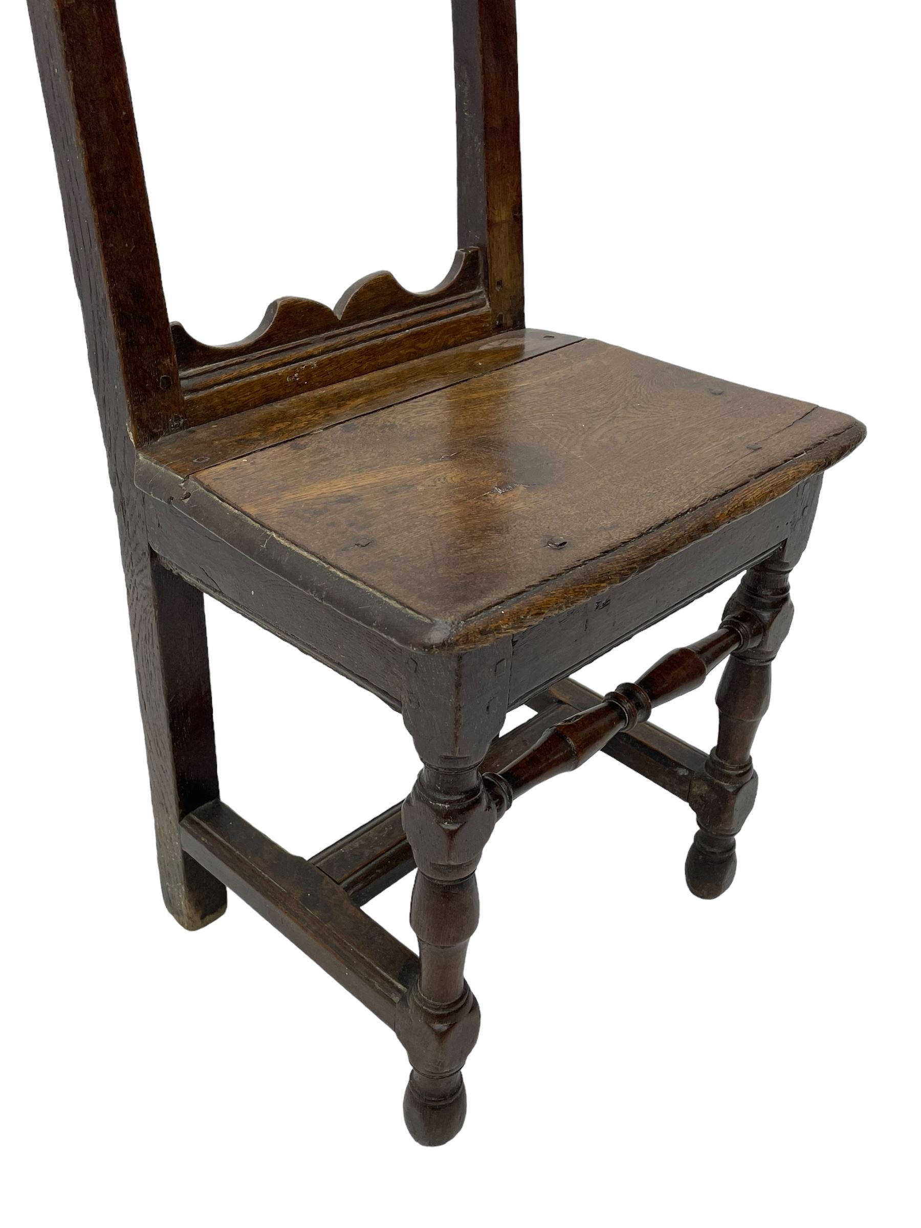 Small late 17th century oak side chair, open frame back with shaped upper and lower brackets, moulded plank seat, on turned supports united by moulded H-shaped stretchers