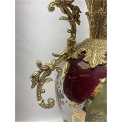 Twin handled vase, the ceramic urn form body decorated with floral sprigs and figural panel, the metal handles designed as vines, together with a similar ewer, vase H75cm 