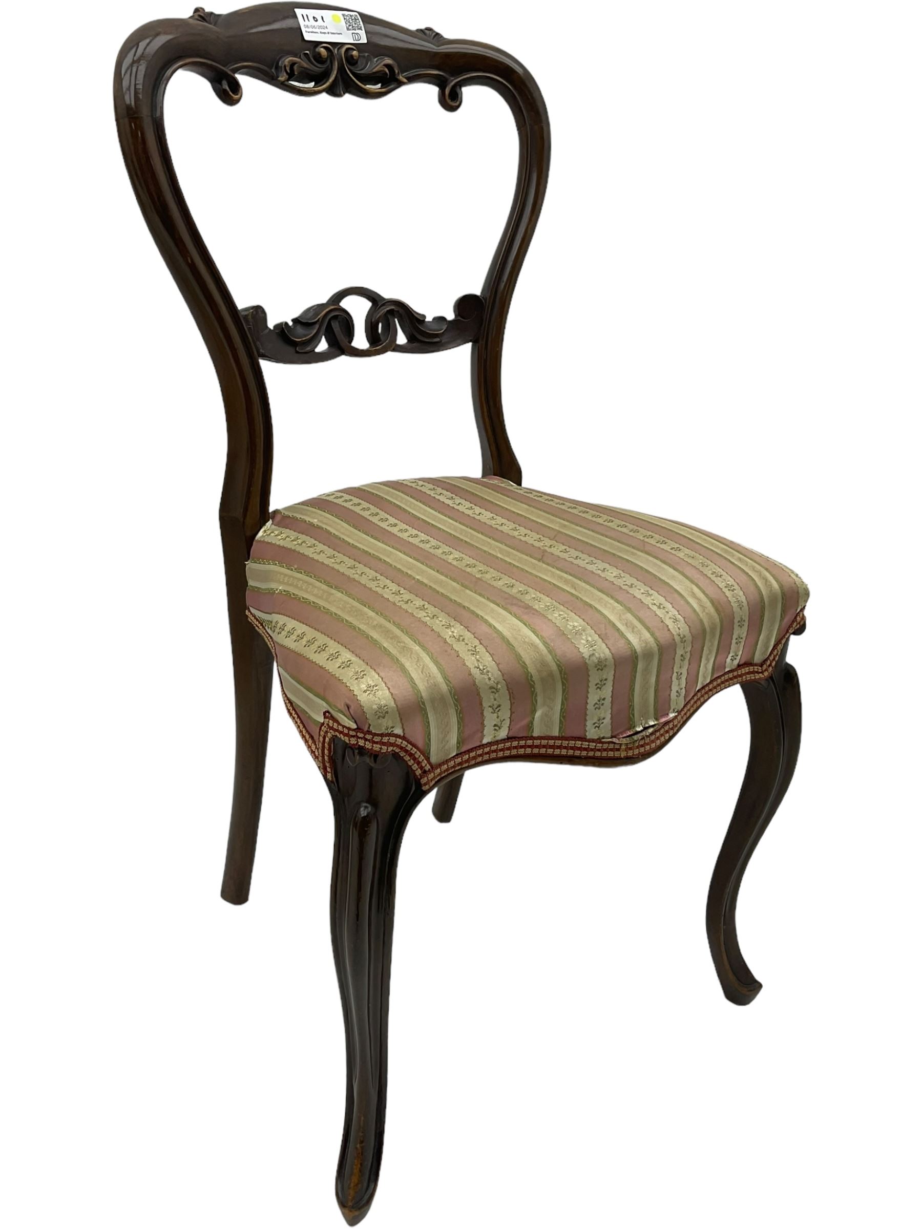 Mixed set of five Victorian chairs - Victorian rosewood dining chair with foliage carved cresting rail; Victorian mahogany balloon back dining chair with foliage carved middle rail; Victorian walnut balloon back dining chair with C-scrolled back; Victorian walnut dining chair with ring and curled leaf carved middle rail; Victorian mahogany balloon back dining chair with C-scroll and foliage carved middle rail (5)