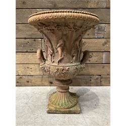 Small cast stone Grecian garden urn, twin handled with figures