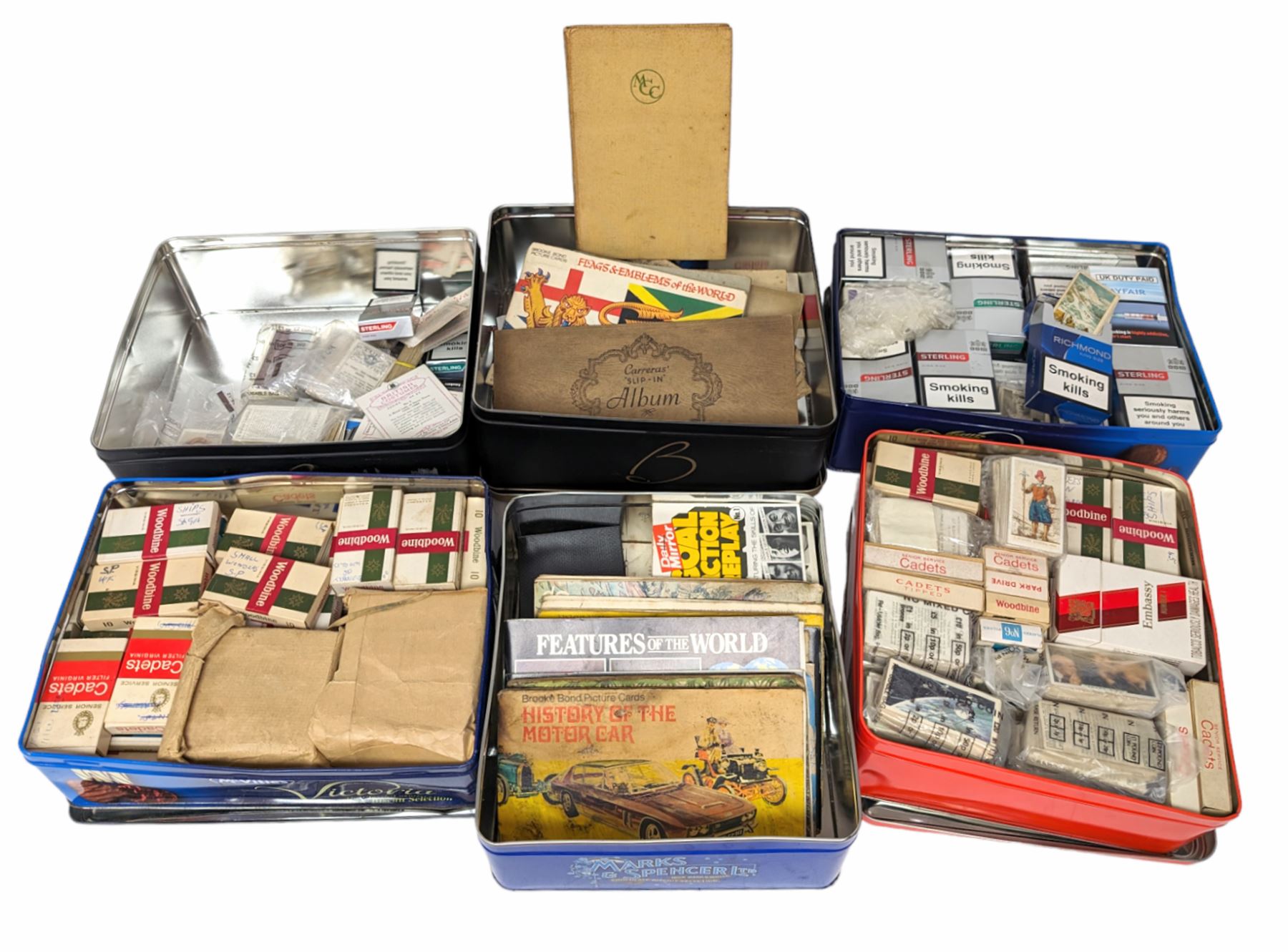 Large quantity of cigarette/tea cards, some loose and in albums, including Carreras, Bond, etc, contained within six tins, together with a Cricket How to Play book