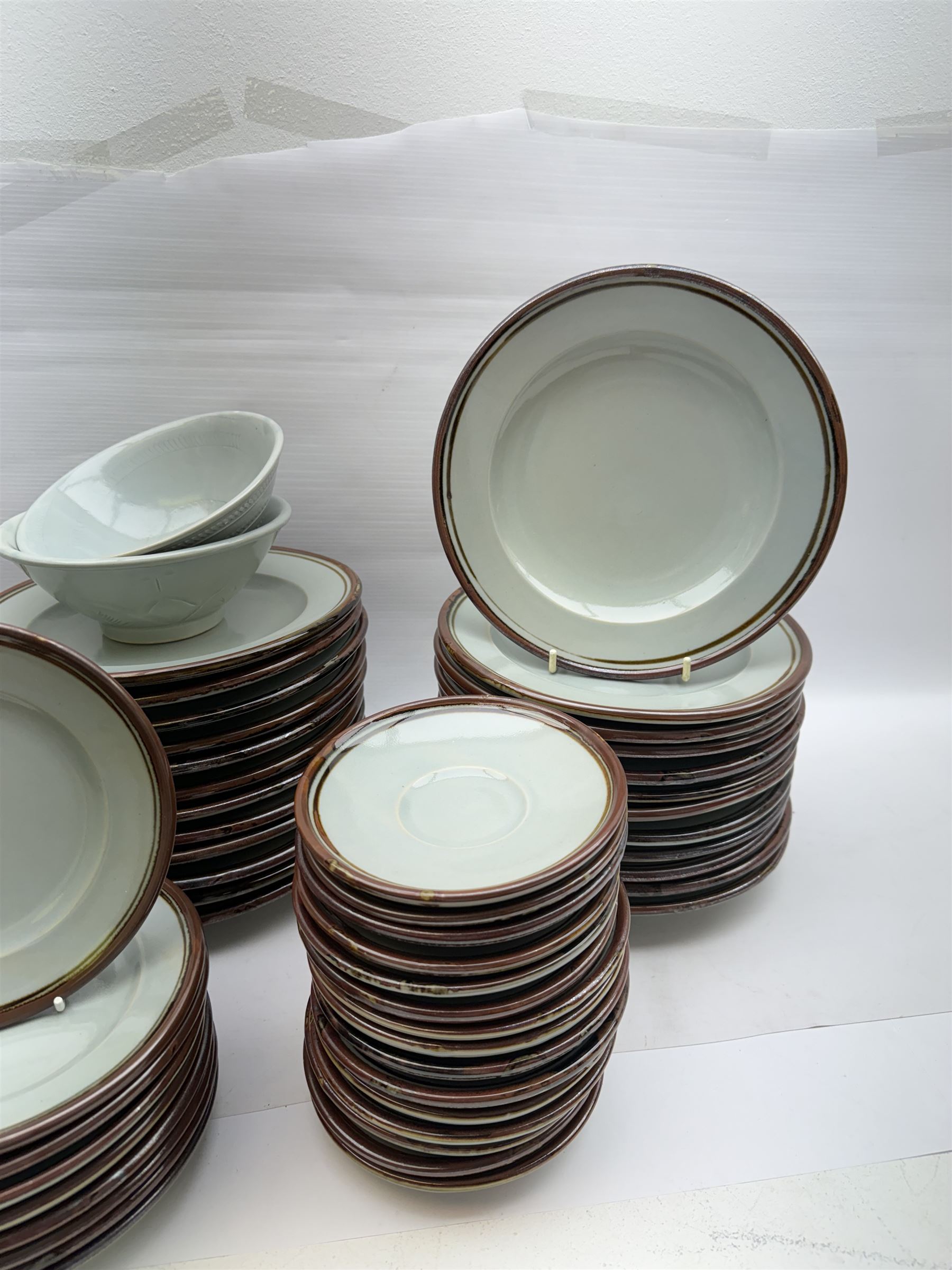 20th century celadon dinner service with iron rim, comprising nineteen dinner plates 26.5cm, twenty-four side plates D24cm, twelve varying bowls, twenty-two tea plates and fifteen saucers 