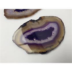 Three purple agate slices, polished with rough edges, of various sizes largest H7cm, L10cm