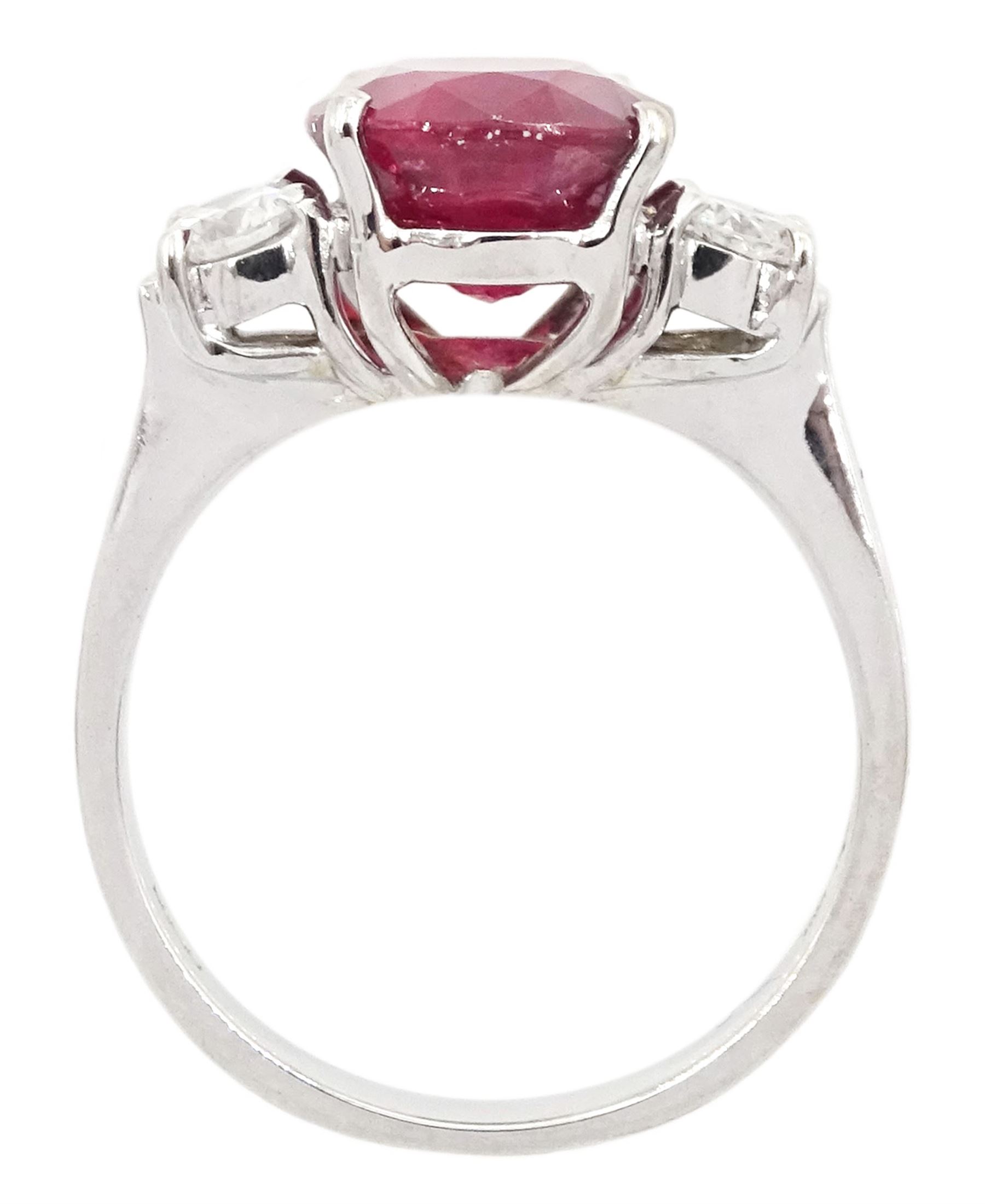 18ct white gold three stone oval cut ruby and round brilliant cut diamond ring, hallmarked, ruby approx 4.30 carat