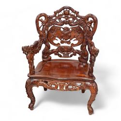 Pair of Japanese carved hardwood throne chairs, pierced and dragon carved cresting over pierced back panel carved with bat, extending dragon carved arms over panelled seat, the seat rails pierced and carved with trailing branches and foliate motifs, on cabriole supports 