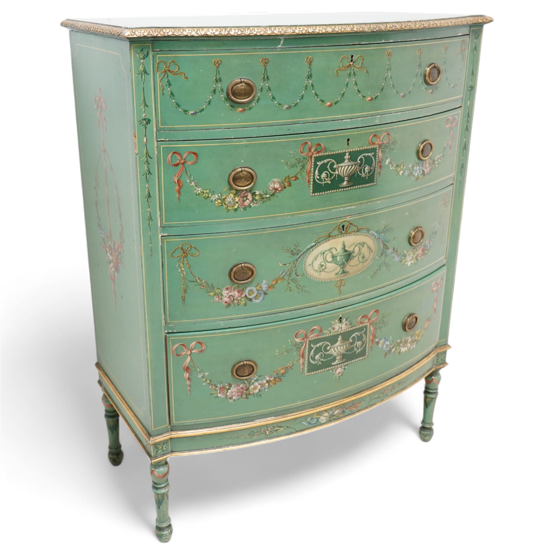 Edwardian Adam Revival green-painted and parcel gilt bowfront chest, moulded and foliate carved top painted with trailing floral band, fitted with four drawers decorated with trailing floral festoons, ribbon ties and urns, oval handle plates with engraved decoration and bead cast handles, on turned supports decorated with acanthus leaves and draped festoons 