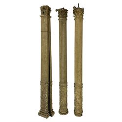 Three 19th century wood and gesso Composite order architectural architraves - curled acanthus leaf capitals over fluted shafts, the bases decorated with guilloche moulding over trailing laurel leaf branches, one half columns, one L-shaped rectangular pilaster and one full column, the largest - H204cm