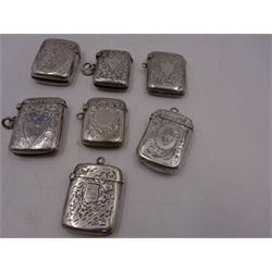 Seven early 20th century silver vesta cases, all of typical form, engraved with foliate and scrolling details, all hallmarked