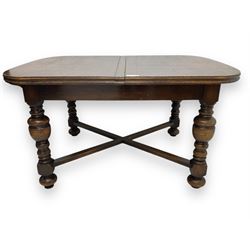 Early 20th century oak extending dining table, rectangular top with rounded corners, on tu...