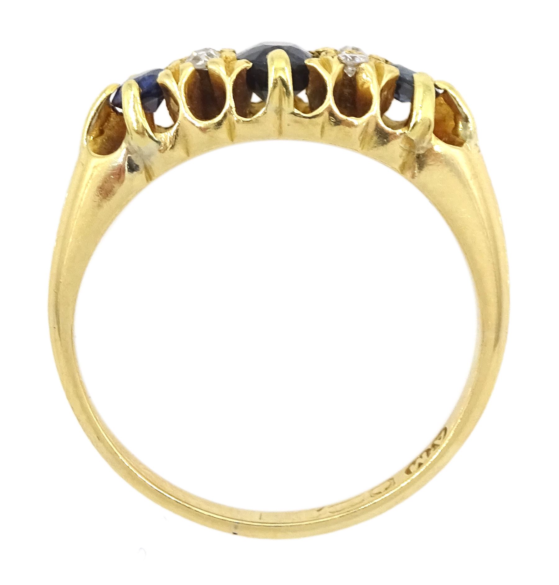 Early 20th century 18ct gold three stone sapphire and four stone old cut diamond ring