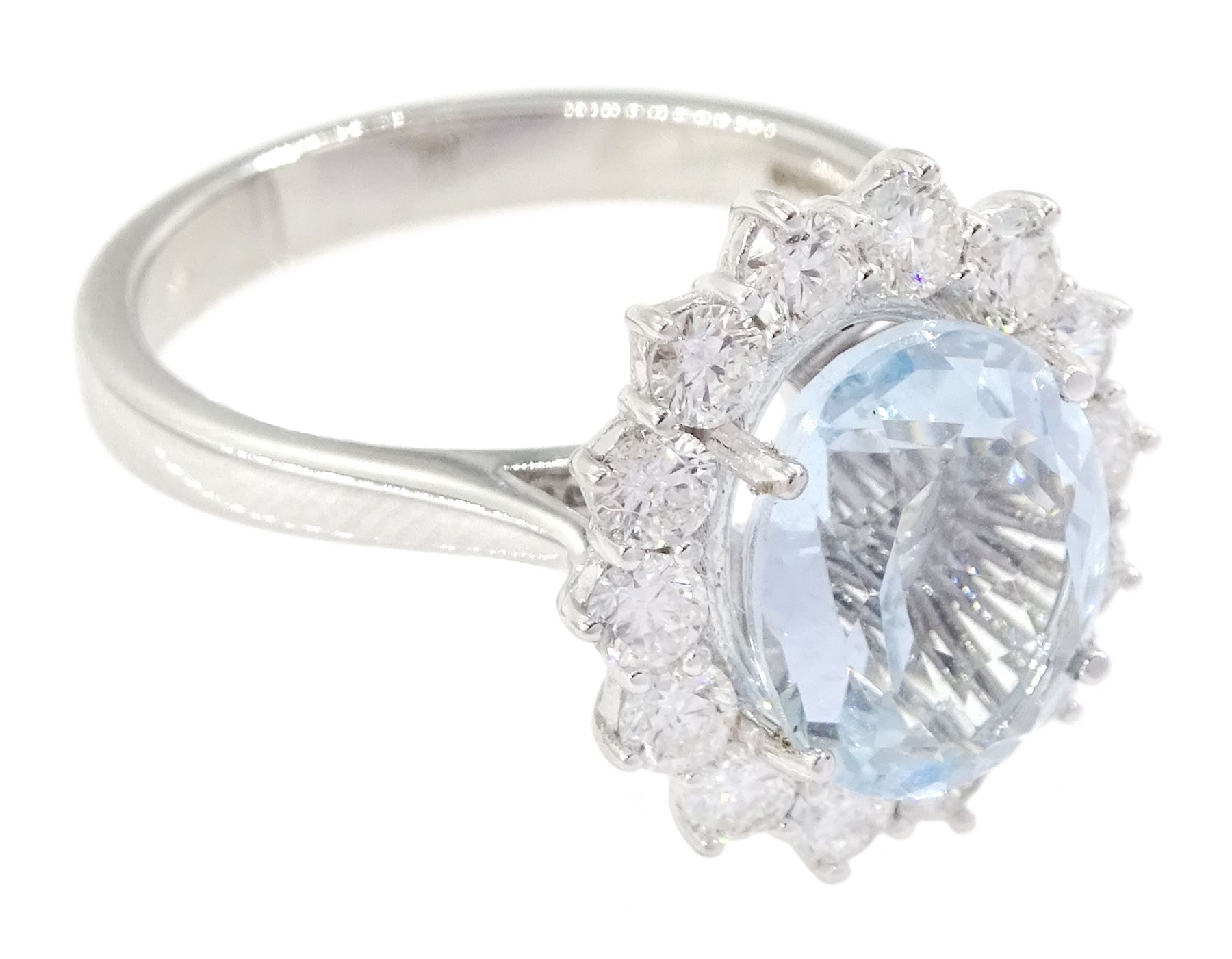 18ct white gold oval cut aquamarine and round brilliant cut diamond cluster ring, hallmarked, aquamarine approx 2.55 carat, total diamond weight approx 0.80 carat