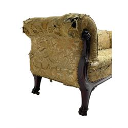 19th century mahogany settee, rolled S-scrolled arms carved with lion masks and acanthus leaf scrolls, the lower moulded rail carved with scrolling design, raised on carved paw feet with recessed brass and ceramic castors 