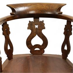 19th century elm and beech smokers bow Captains armchair, shaped and pierced splat, saddle seat, double H stretcher