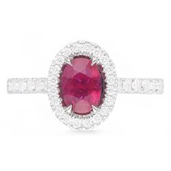 18ct white gold oval cut ruby and round brilliant cut diamond cluster ring, with diamond set shoulders, hallmarked, ruby approx 0.80 carat, total diamond weight 0.37 carat 