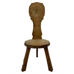 Gnomeman - two oak spinning or hall chairs, shaped splat backs, one carved with Yorkshire Rose, the other with mythical dragon, decagon seats on chamfered square tapering supports, each carved with gnome signature, by Thomas Whittaker, Littlebeck