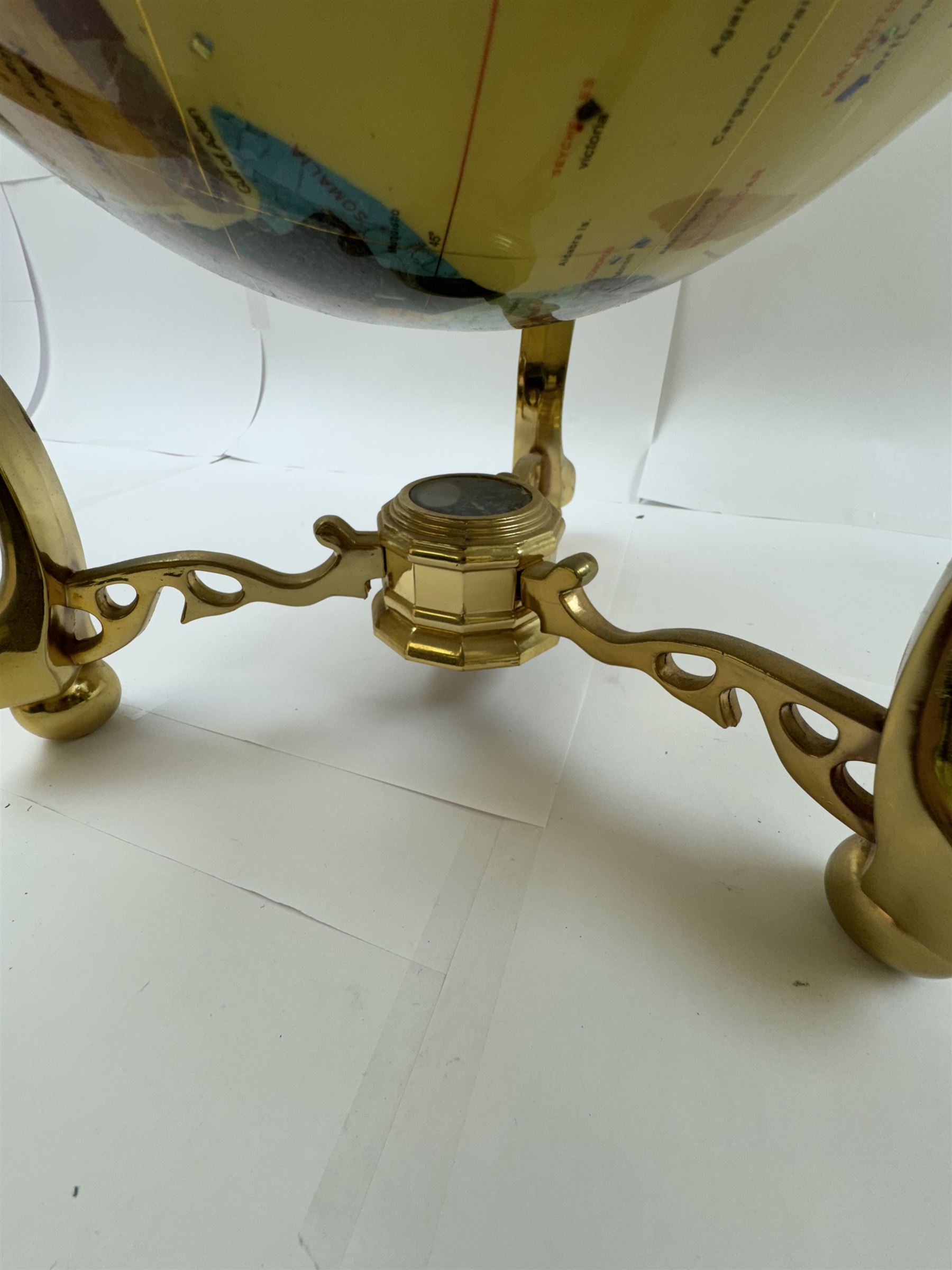 Polished gemstone terrestrial globe on gilt metal stand, H47cm