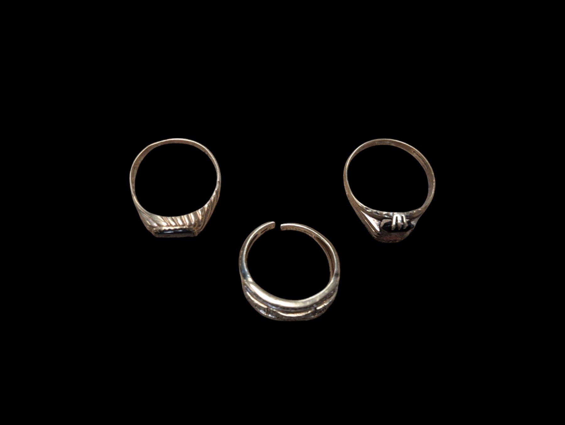 Three 9ct gold stone set rings, including diamond cluster ring, onyx ring and garnet ring, all hallmarked 