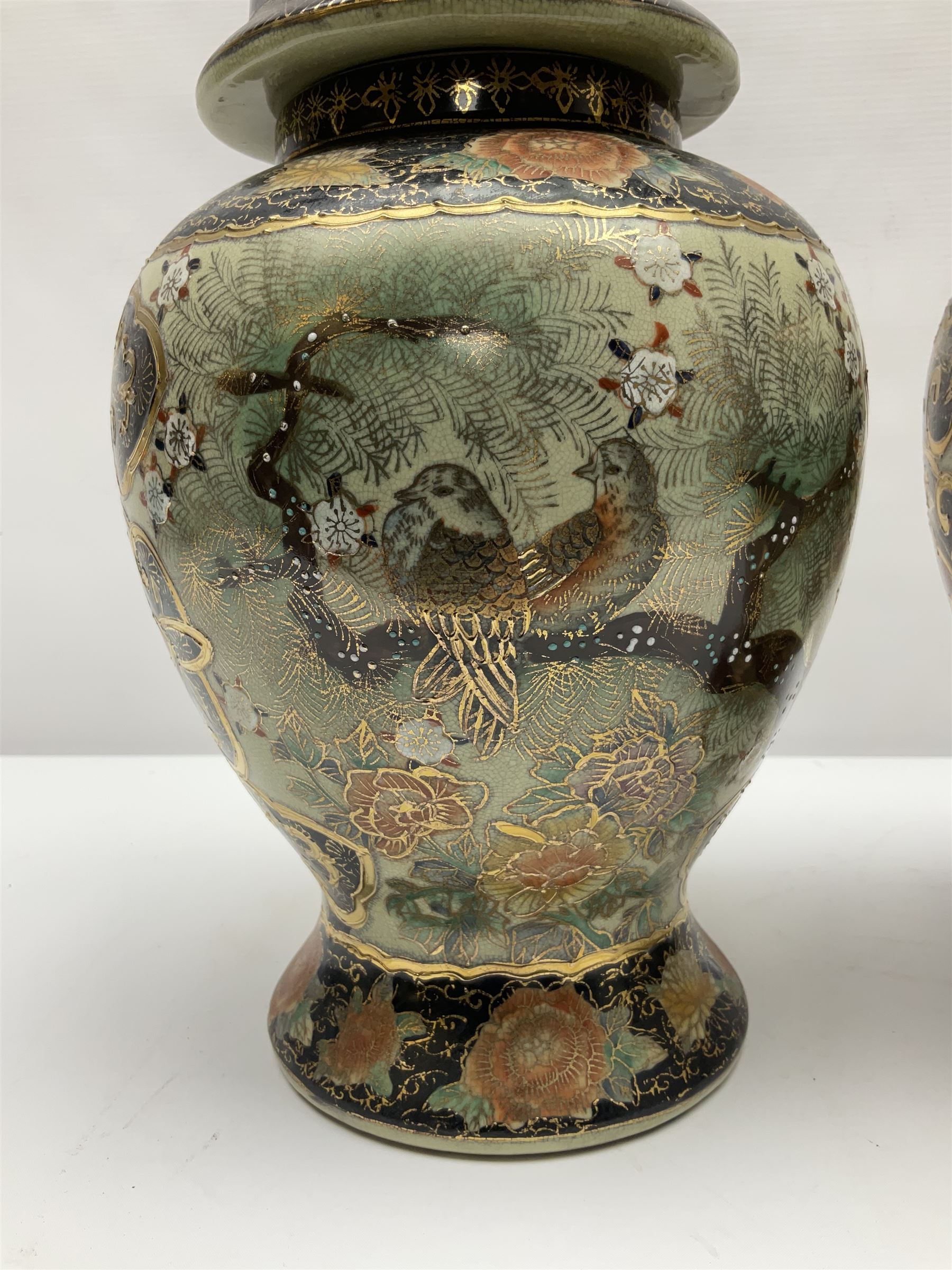 Pair of Chinese Satsuma baluster shaped lidded vases, decorated with birds perched amongst peonies, H36cm 