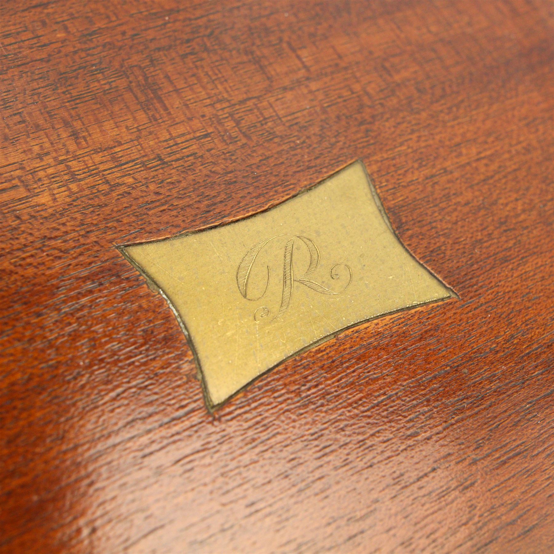 19th century Mahogany stationery box inlaid with boxwood stringing, the hinged sloping lid inset with a brass plaque engraved with initial 'R', divided interior with Sothebys lot label 'November 1991' W39cm