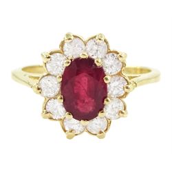 14ct gold oval cut ruby and round brilliant cut diamond cluster ring, stamped, ruby approx...