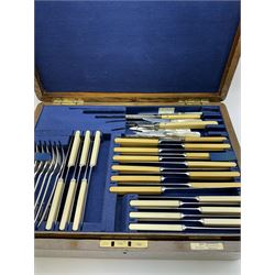 Walker & Hall canteen of plated cutlery for for twelve place settings, all knives with ivory effect handles, within an oak canteen case with a brass shield to the lid, with key, case  