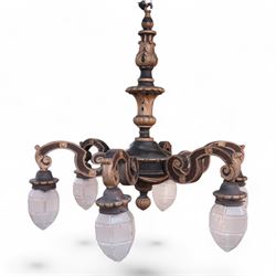 Baroque design carved wood and parcel gilt chandelier, the turned stem carved with curled ...