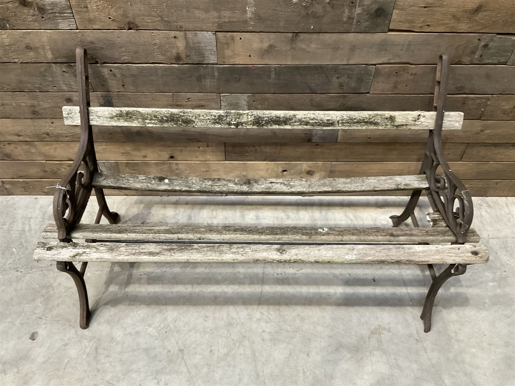 Pair of faux bois cast metal bench ends; together with wooden slatted bench with metal ends