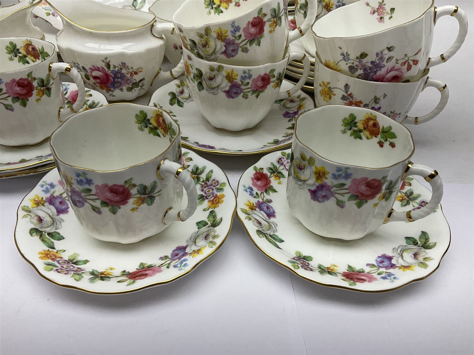 Royal Crown Derby Posies pattern tea service, including two milk jugs, two open sucrier, twelve teacups and saucers, twelve dessert plates etc 