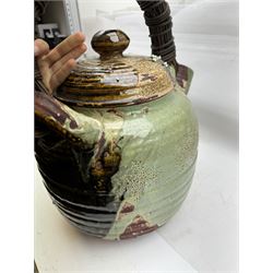 Very large Japanese Shigakari type coil built teapot, the body with a blossoming encrusted tree, woven loop handle and part green glazed spout and cover, H52cm