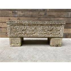 Cast stone rectangular garden planter raised on plinth feet