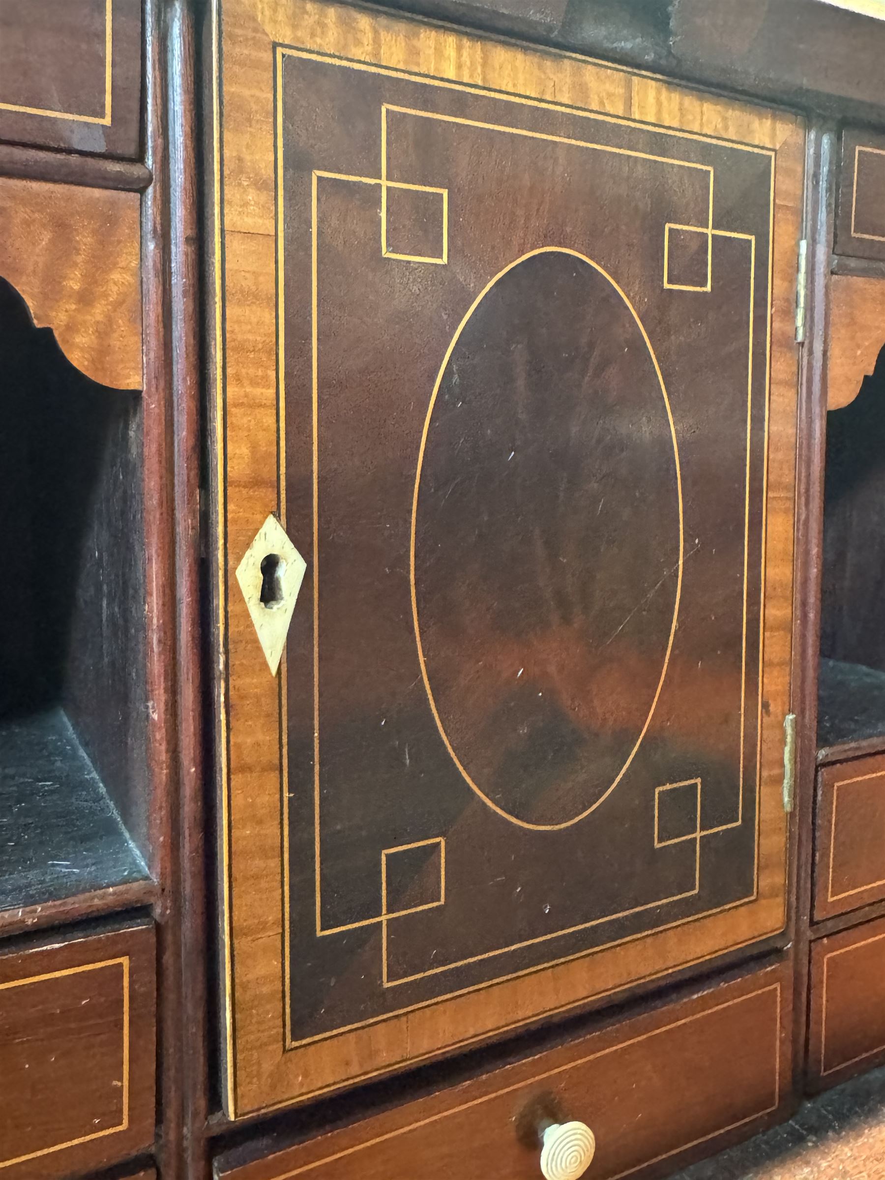 Georgian mahogany bureau, moulded fall front enclosing cupboard, small drawers, pigeonholes and inset writing surface, fitted with four long graduating cock-beaded drawers, on splayed bracket feet 