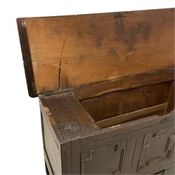 18th century oak mule chest, rectangular hinged top with moulded edge enclosing candle box, the triple panelled front with geometric fielded mouldings, fitted with single drawer to base, raised on stile feet