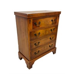 Georgian design yew wood bachelor's chest, fold-over rectangular top supported by pull-out stays, fitted with four long cock-beaded drawers, on bracket feet