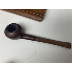 Collection of smoking pipes including Meerschaum pipe, carved as a female head, Briars and clay examples, etc and four pipe racks/stands