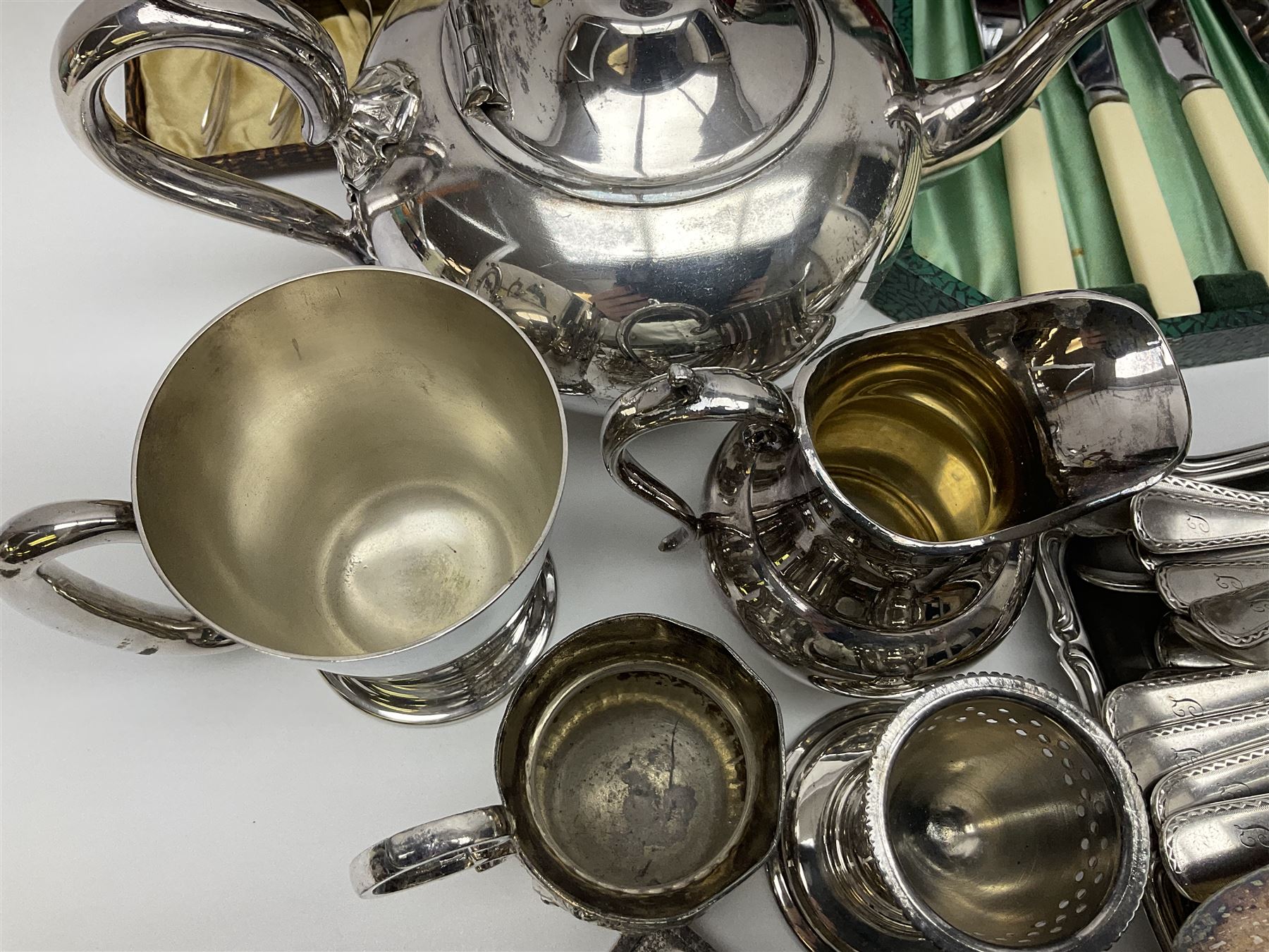 Silver plated four piece tea service, comprising teapot, coffee pot, open sucrier and milk jug, together with card case embossed with animals, flatware etc, 