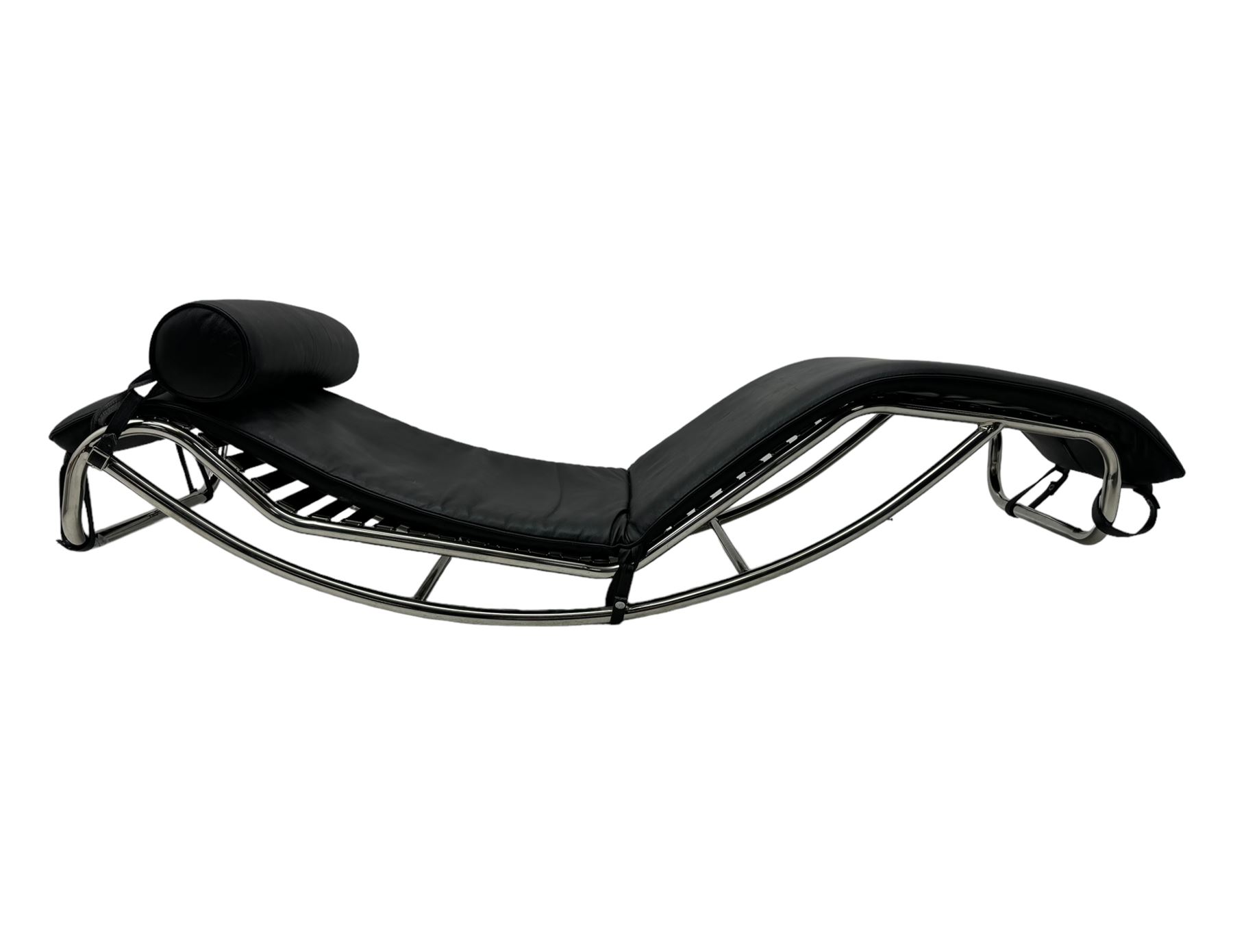 After Le Corbusier, Pierre Jeanneret, and Charlotte Perriand - LC4 chaise longue, black leather upholstery with cylindrical headrest, supported by a chromed tubular steel frame, with cantilever design with elastic webbing