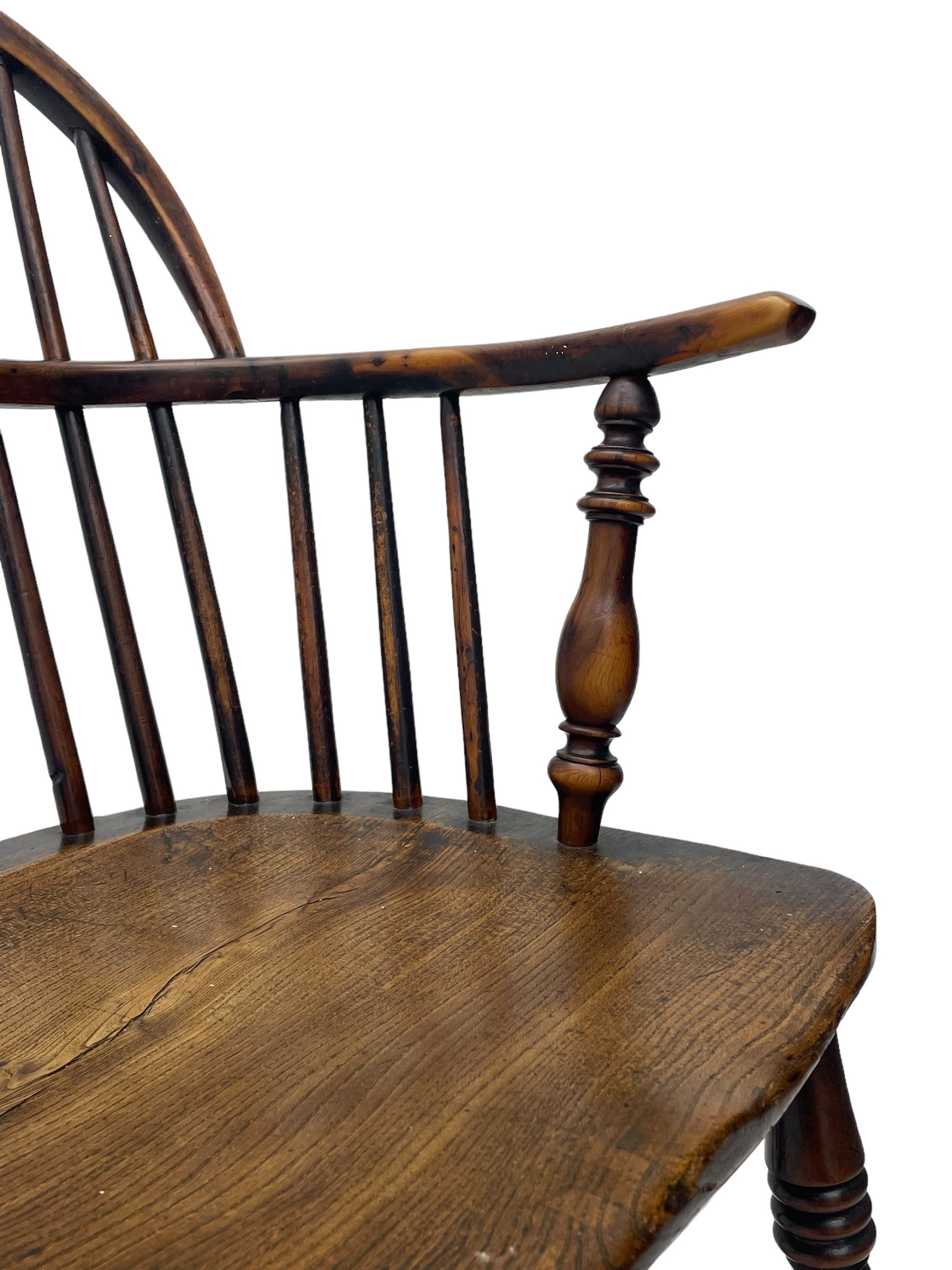 19th century yew wood and elm Windsor armchair, low double hoop stick and pierced splat back, dished seat on turned supports united by crinoline stretchers